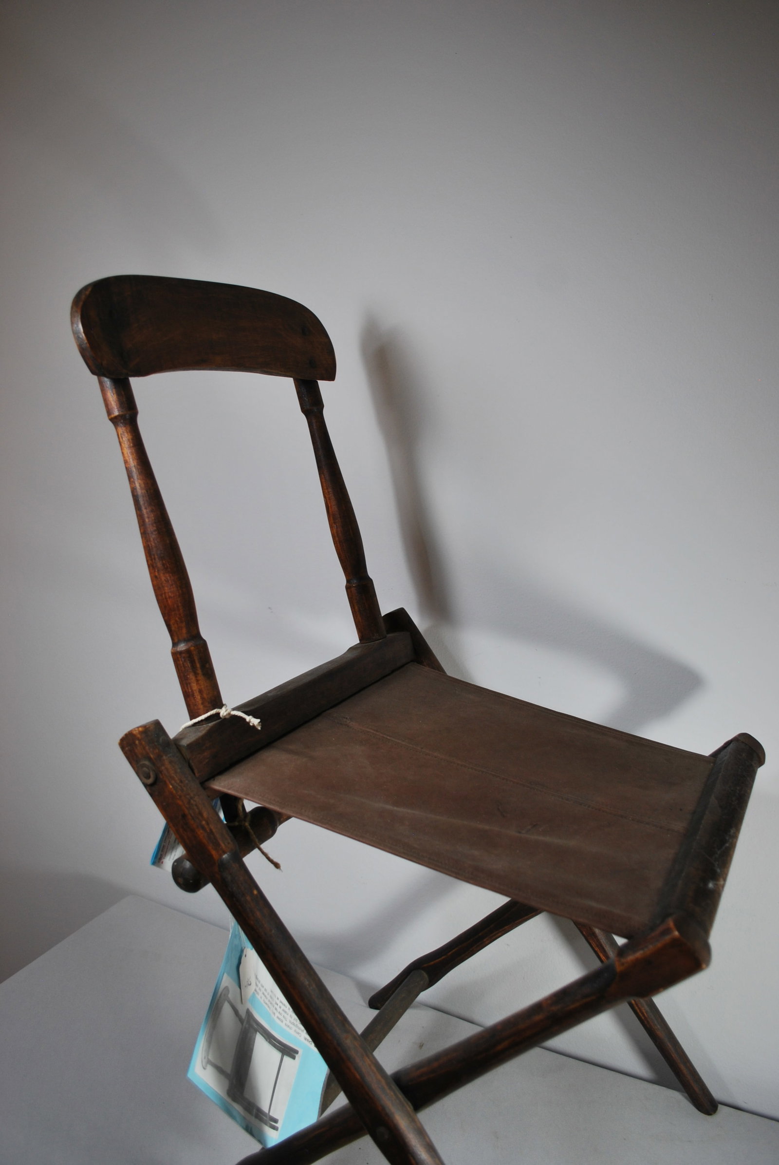 Civil War officer's camp chair: wood frame, fabric seat, folding