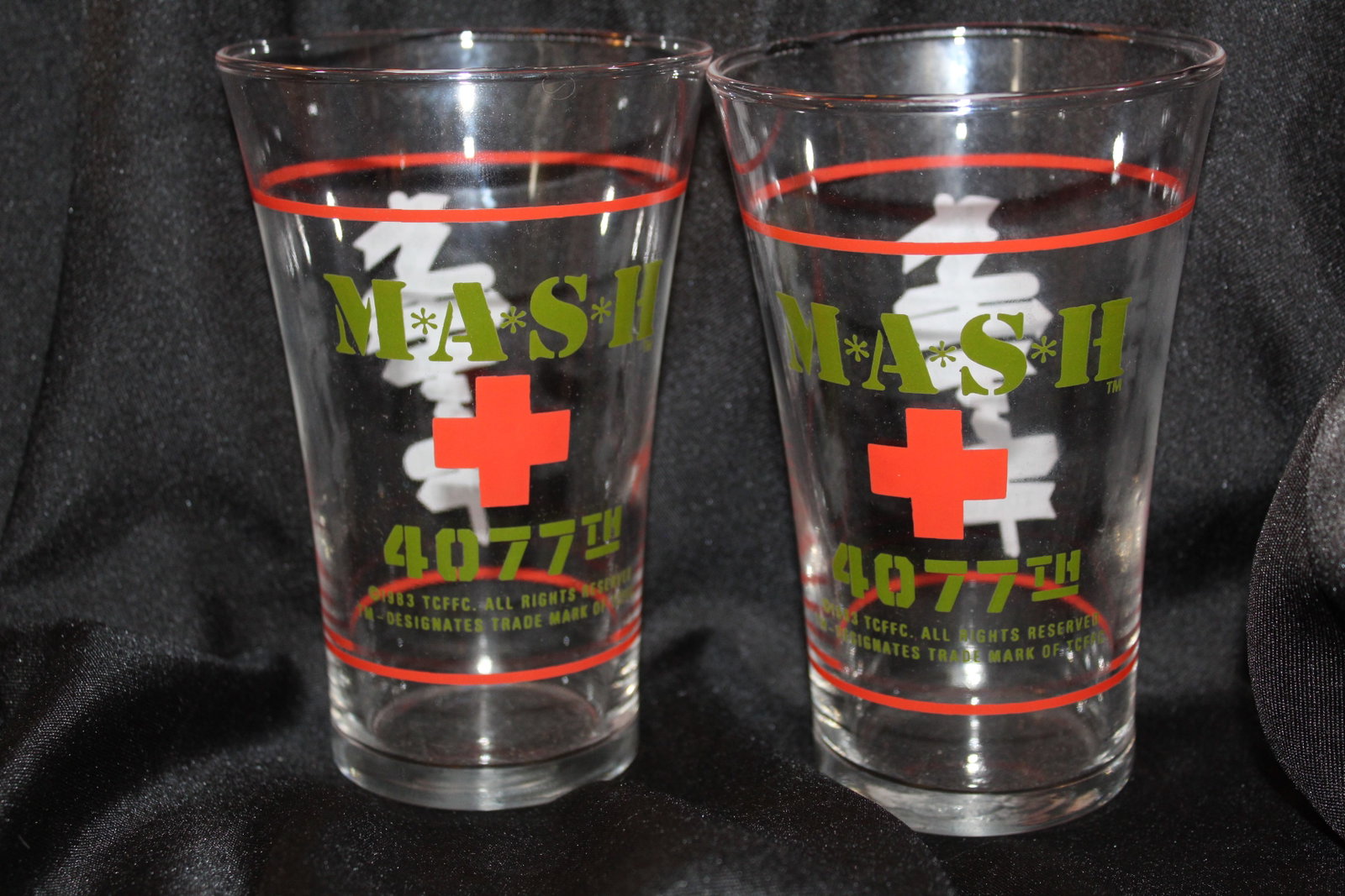 Set of 2 Vintage 1983 M*A*S*H 4077th Drinking Glasses: 2 matching vintage 1983 MASH drinking glasses/tumblers featuring the logo, 4077th, and the signpost. Great collectors item, both are in like new condition.