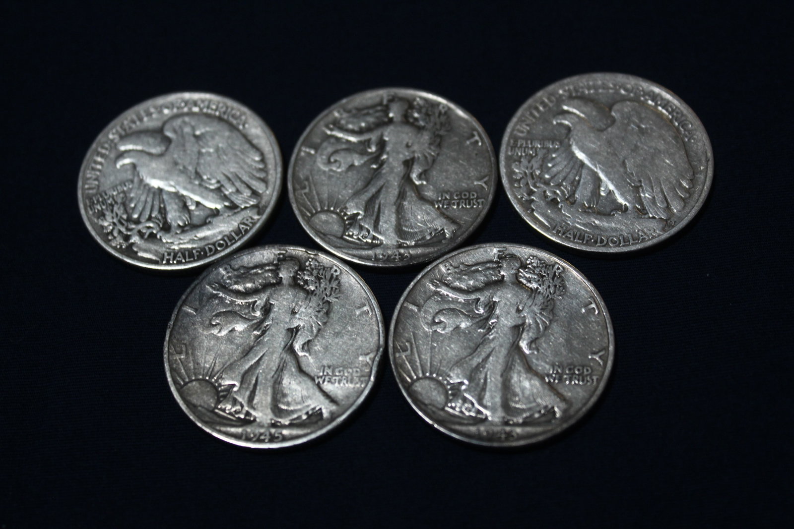 (5) 1940's Walking Liberty Half Dollars: Lot of 5 1940's Half Dollar, cleaned thoroughly and in great condition.