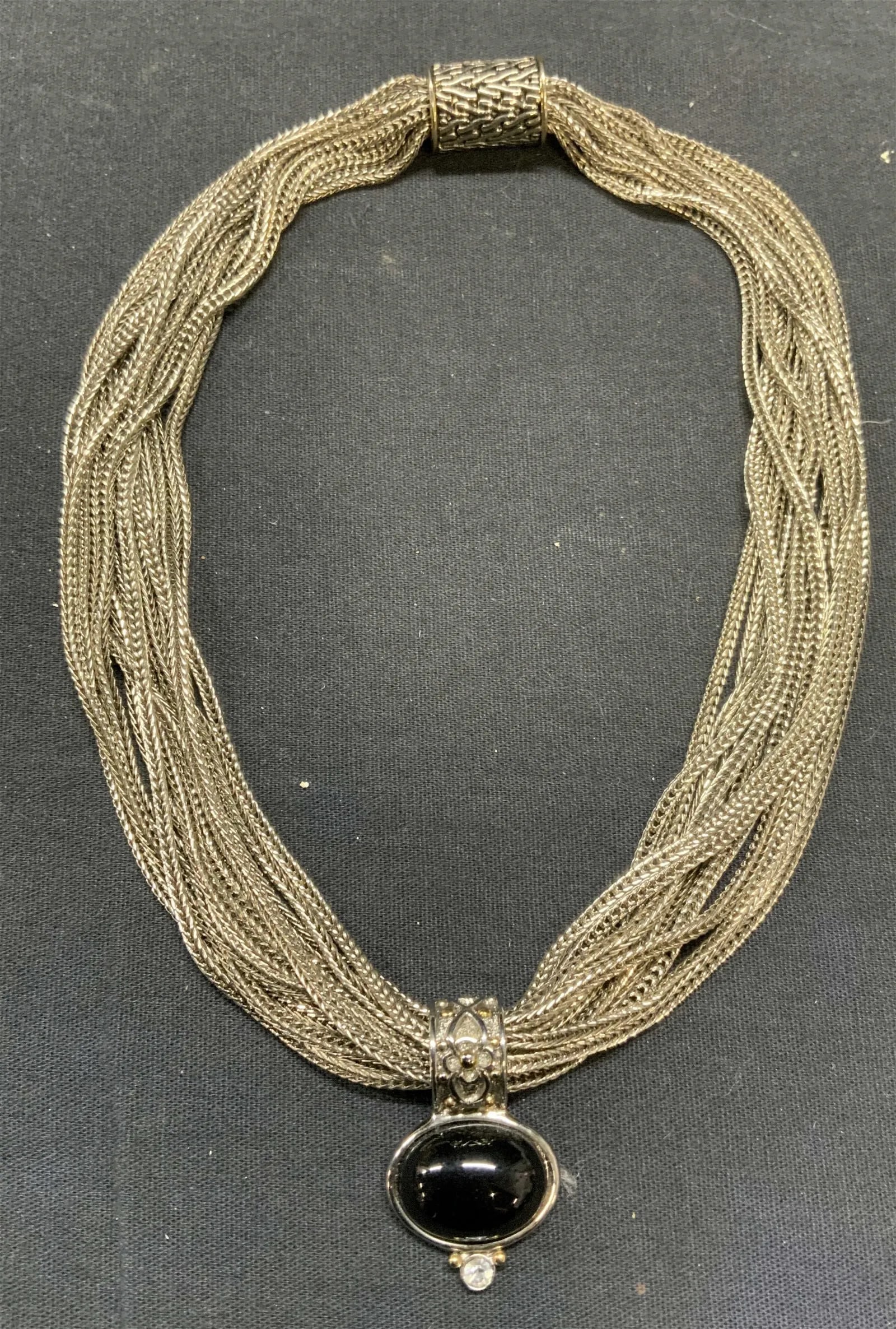 Vintage Silver Tone Multi Strand Necklace: Vintage silver tone multi strand necklace with black cabochon and colorless crystal pendant. Drop length approx. 7 inches. Some scratching observed.