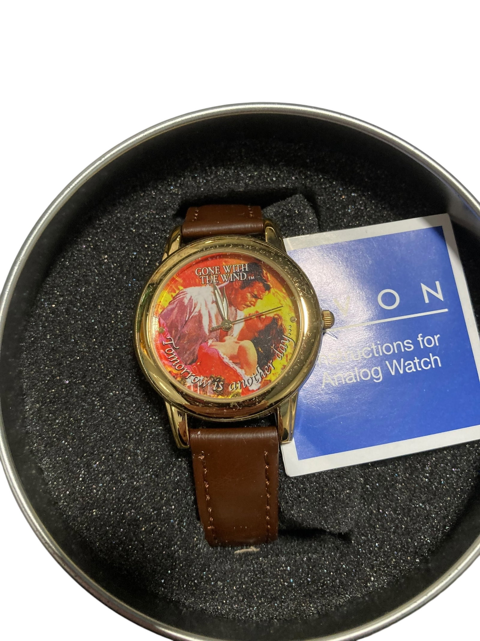 AVON Gone With The Wind Watch IN BOX: Gone With The Wind themed watch from Avon in its original box. Some slight wear to the face and wrist strap. This item is UNTESTED. Please note that this item is sold as is.