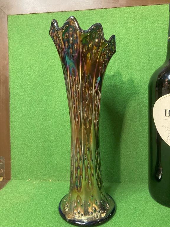 Fenton Carnival Glass Tall Fluted Knotted Beads Vase: Tall fluted vase with knotted bead detailing by Fenton. Color is very opalescent, appearing to be multicolored. In excellent condition with no damage. Low Estimate: 10.00 High Estimate: 100.00 Conditi