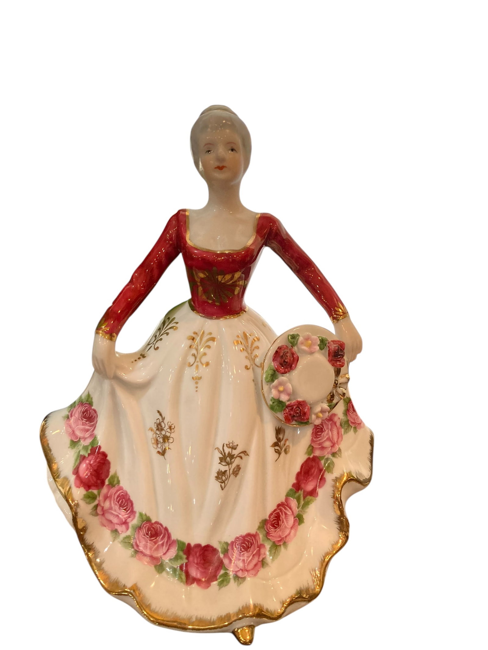 Lot of 5 Porcelain Lady Figurines: 5 porcelain figurines of women in vintage attire. The tallest of the bunch is a music box. These items are all in great condition.