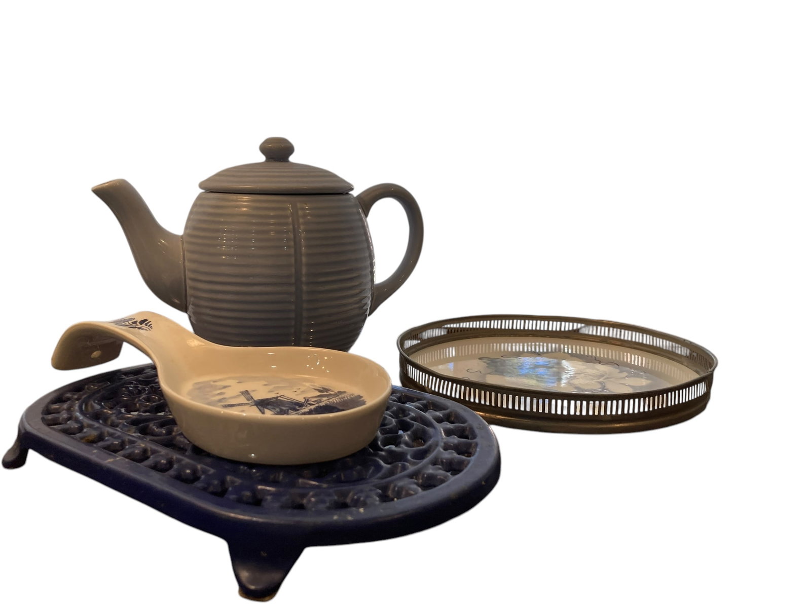 Lot of Blue + White Kitchen Decor : Lot of 4 pieces of blue and white kitchen decor pieces. Includes a blue teapot, blue and white spoon rest, blue heavy trivet, Delft spoon rest and serving tray.