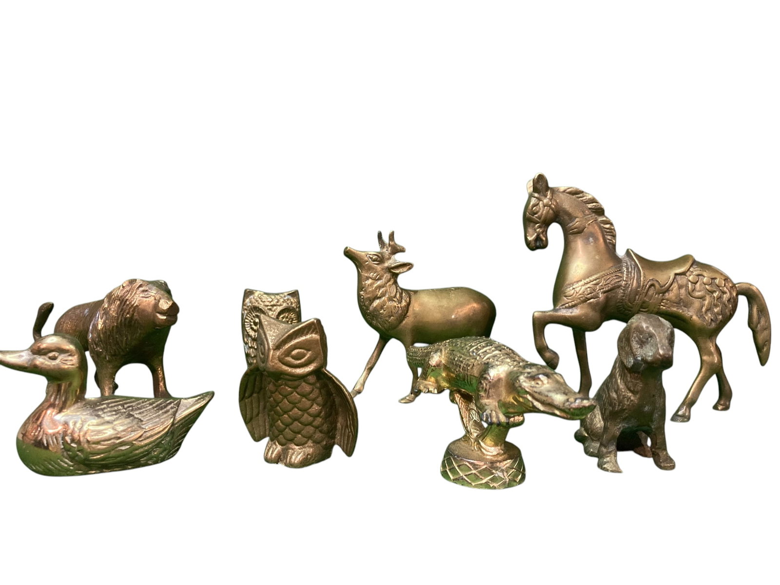 Lot of 8 Miniature Brass Animals: Lot of 8 miniature brass animals including an owl, a lion, an alligator, a duck, a pig, a horse, a deer and a dog. All are in various conditions ranging from good-great.