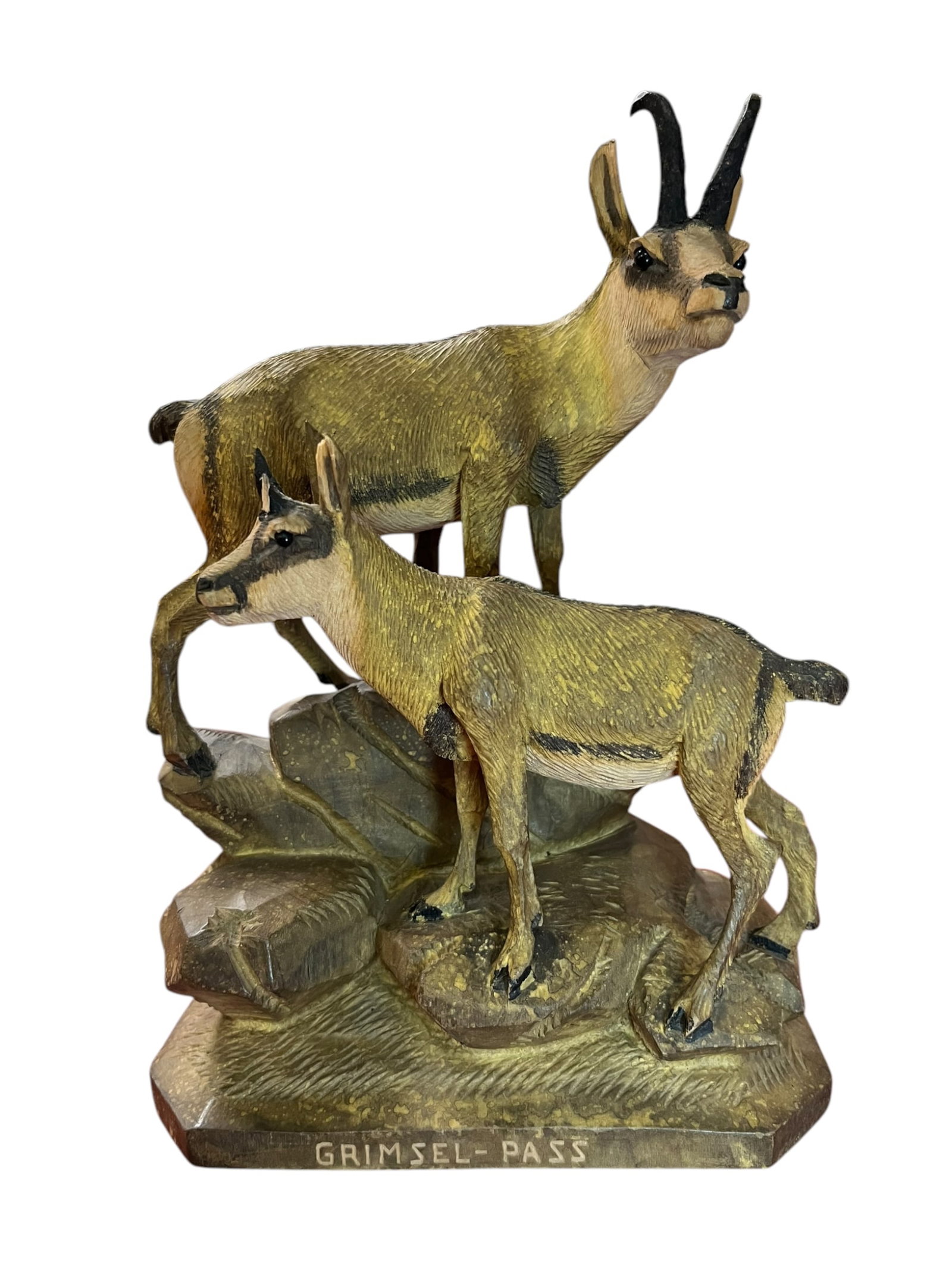 Hand Carved Wooden Chamois Statuette: Statuette hand carved from wood in the shape of a Chamois Goat. Reads "Grimsel-Pass" on the base. In great condition with no chips or breaks.