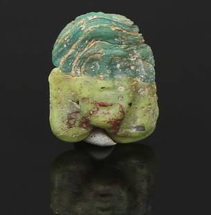 Roman theatrical mask bead: ITEM: Theatrical mask bead MATERIAL: Glass CULTURE: Roman PERIOD: 1st - 3rd Century A.D DIMENSIONS: 20 mm x 16 mm CONDITION: Good condition PROVENANCE: Ex American private collection,