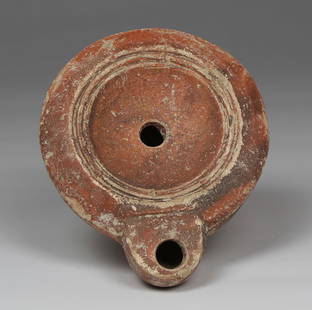 Roman factory oil lamp with makers mark, Type Bussière D II 1: ITEM: Factory oil lamp with makers mark, Type Bussière D II 1 MATERIAL: Pottery CULTURE: Roman PERIOD: 1st - 3rd Century A.D DIMENSIONS: 28 mm x 73 mm x 89 mm CONDITION: Good condition PR