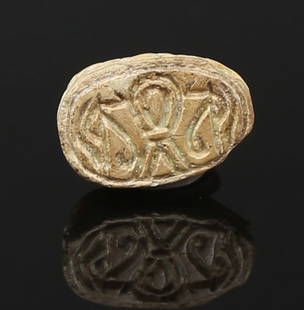 Egyptian scarab with pseudo-hieroglyphic, Sa-sign and Udjat-eyes (protection): ITEM: Scarab with pseudo-hieroglyphic, Sa-sign and Udjat-eyes (protection) MATERIAL: Steatite CULTURE: Egyptian PERIOD: New Kingdom, 1550 - 1070 B.C DIMENSIONS: 11 mm x 7 mm CONDITION: Good condition