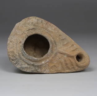 Byzantine oil lamp with inscription 'The light of Christ shines for all': ITEM: Oil lamp with inscription 'The light of Christ shines for all' MATERIAL: Pottery CULTURE: Byzantine PERIOD: 4th - 5th Century A.D DIMENSIONS: 30 mm x 59 mm x 85 mm CONDITION: Good condition