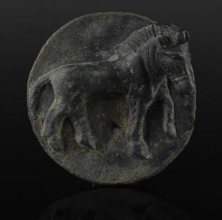 Roman military phalera depicting a standing horse: ITEM: Military phalera depicting a standing horse MATERIAL: Bronze CULTURE: Roman PERIOD: 2nd - 3rd Century A.D DIMENSIONS: 57 mm diameter CONDITION: Good condition PROVENANCE: Ex German private