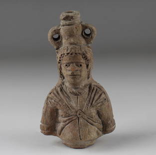 Roman flask in the form of a bust of a Nubian: ITEM: Flask in the form of a bust of a Nubian MATERIAL: Pottery CULTURE: Roman, Egypt PERIOD: 2nd - 1st Century B.C DIMENSIONS: 105 mm x 58 mm CONDITION: Good condition PROVENANCE: Ex Austrian
