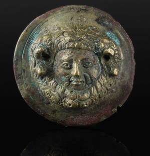 Roman military phalera with the head of Zeus Ammon: ITEM: Military phalera with the head of Zeus Ammon MATERIAL: Bronze CULTURE: Roman PERIOD: 1st - 3rd Century A.D DIMENSIONS: 61 mm diameter CONDITION: Good condition PROVENANCE: Ex French private