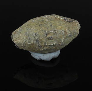 Greek sling bullet with inscription 'NA / MER': ITEM: Sling bullet with inscription 'NA / MER' MATERIAL: Lead CULTURE: Greek PERIOD: 4th Century B.C DIMENSIONS: 15 mm x 30 mm CONDITION: Good condition PROVENANCE: Ex English private collection,