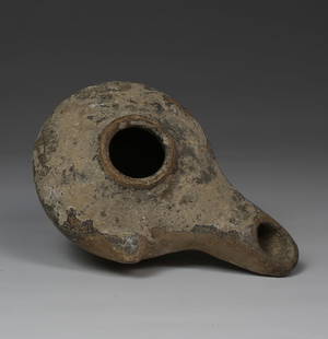 Greek oil lamp, Type Howland 29 A: ITEM: Oil lamp, Type Howland 29 A MATERIAL: Pottery CULTURE: Greek PERIOD: 4th - 3rd Century B.C DIMENSIONS: 35 mm x 57 mm x 90 mm CONDITION: Good condition PROVENANCE: Ex French private collection,