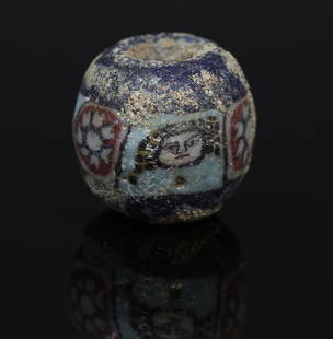 Romano-Egyptian face bead, probably Medusa: ITEM: Face bead, probably Medusa MATERIAL: Mosaic glass CULTURE: Romano-Egyptian PERIOD: 1st Century B.C - 1st Century A.D DIMENSIONS: 13 mm diameter CONDITION: Good condition PROVENANCE: Ex Dutch