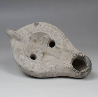 Christian oil lamp depicting a monogrammatic cross, Type Bussière E IX 31 - Atlante X A1 a: ITEM: Oil lamp depicting a monogrammatic cross, Type Bussière E IX 31 - Atlante X A1 a MATERIAL: Pottery CULTURE: Christian PERIOD: 5th - 7th Century A.D DIMENSIONS: 46 mm x 76 mm x 125 mm