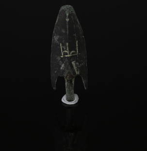 Seleucid arrowhead with emblem of Antiochos VII Sidetes: ITEM: Arrowhead with emblem of Antiochos VII Sidetes MATERIAL: Bronze CULTURE: Seleucid Empire PERIOD: Battle against the Hasmoneans, 138 B.C DIMENSIONS: 45 mm x 16 mm CONDITION: Good condition