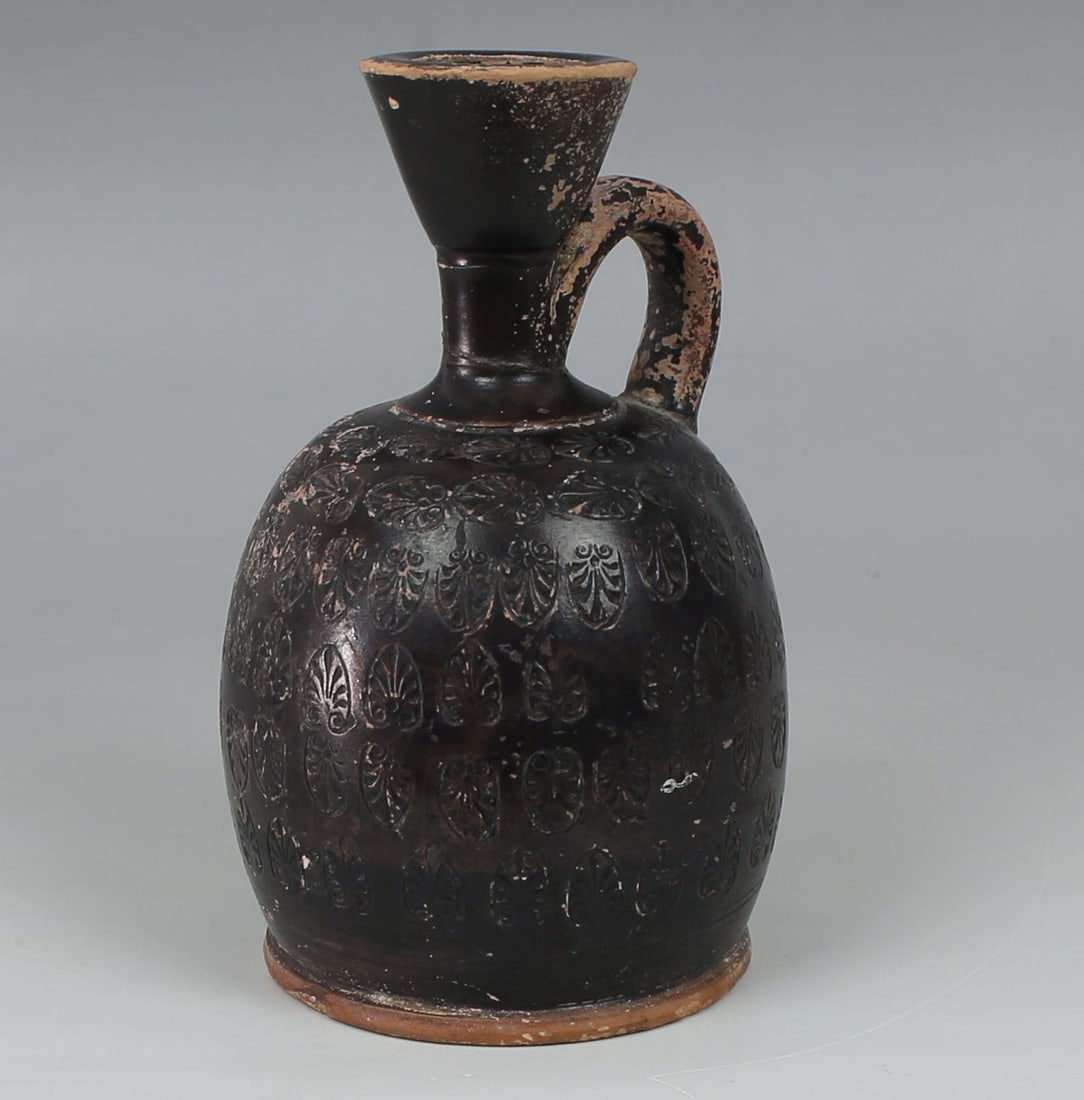 Greek squat lekythos with palmettes: ITEM: Squat lekythos with palmettes MATERIAL: Pottery CULTURE: Greek PERIOD: 5th - 4th Century B.C DIMENSIONS: 105 mm x 60 mm CONDITION: Good condition PROVENANCE: Ex European private