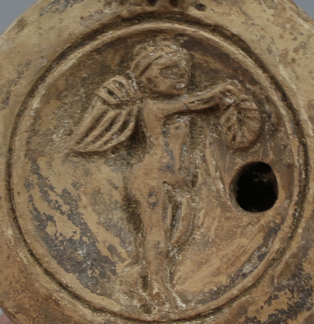 Roman oil lamp, Type Bussière D II: ITEM: Oil lamp, Type Bussière D II MATERIAL: Pottery CULTURE: Roman PERIOD: 1st - 3rd Century A.D DIMENSIONS: 35 mm x 70 mm x 102 mm CONDITION: Good condition PROVENANCE: Ex American