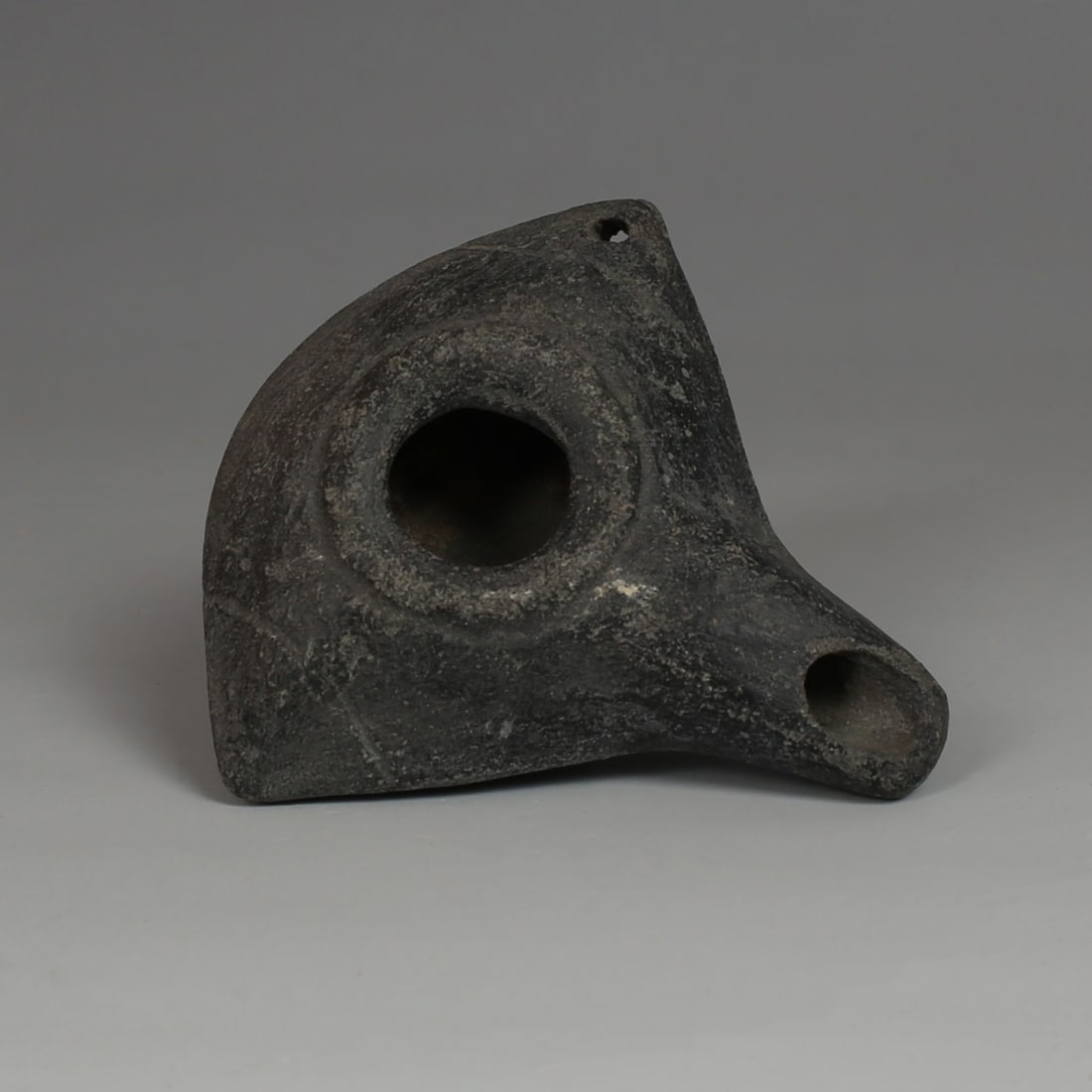 Greek oil lamp: ITEM: Oil lamp MATERIAL: Pottery CULTURE: Greek PERIOD: 4th - 3rd Century B.C DIMENSIONS: 27 mm x 73 mm x 75 mm CONDITION: Good condition PROVENANCE: Ex French private collection, acq
