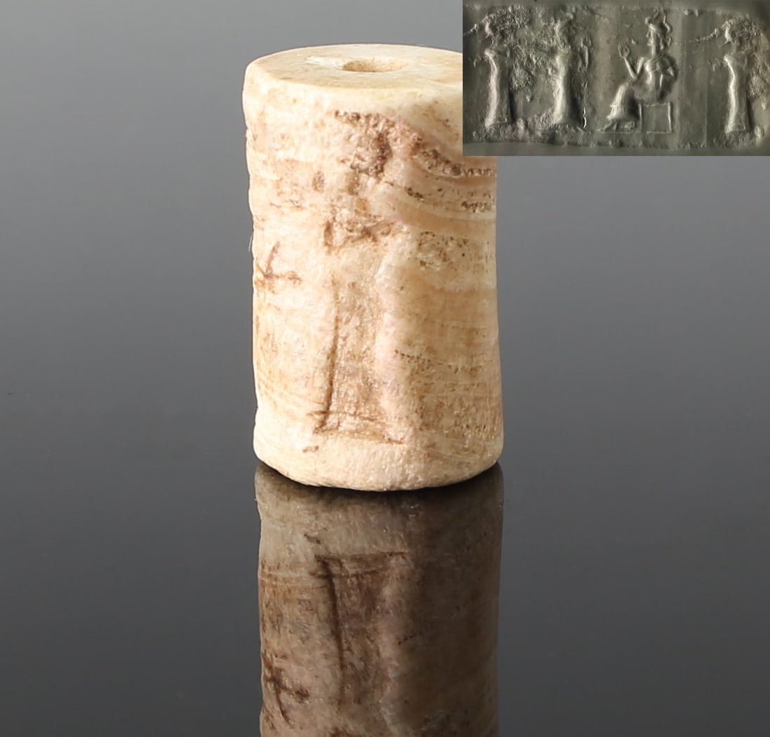 Bronze Age, Mesopotamian, Large Ur III cylinder seal with the goddess Ningal, an intercession: ITEM: Cylinder seal with the goddess Ningal, an intercession goddess and a worshipper MATERIAL: Alabaster CULTURE: Bronze Age, Mesopotamian PERIOD: Large Ur III, 2100 B.C DIMENSIONS: 31 mm x 19 mm dia