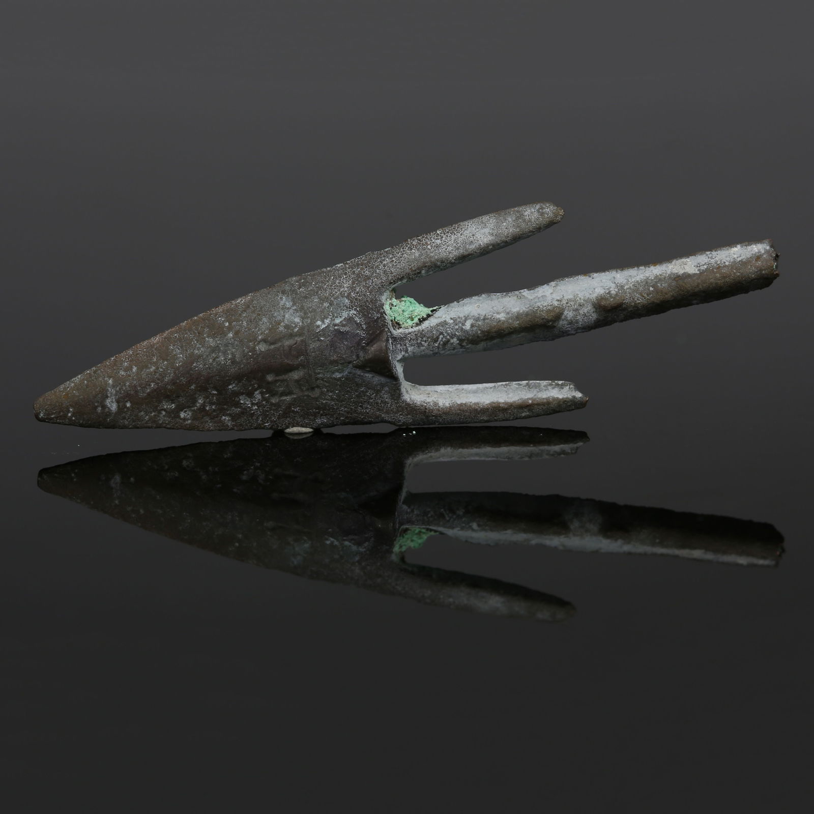 Seleucid arrowhead with emblem of Antiochos VII Sidetes: ITEM: Arrowhead with emblem of Antiochos VII Sidetes MATERIAL: Bronze CULTURE: Seleucid Empire PERIOD: Battle against the Hasmoneans, 138 B.C DIMENSIONS: 65 mm x 18 mm CONDITION: Good condition