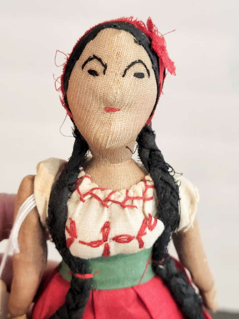 vintage or antique Mexican ethnic doll: cloth doll, label suggests from 1934, with hand sewn features and traditional clothing, original price tag from the 1970's when purchased about 8 1/2" tall