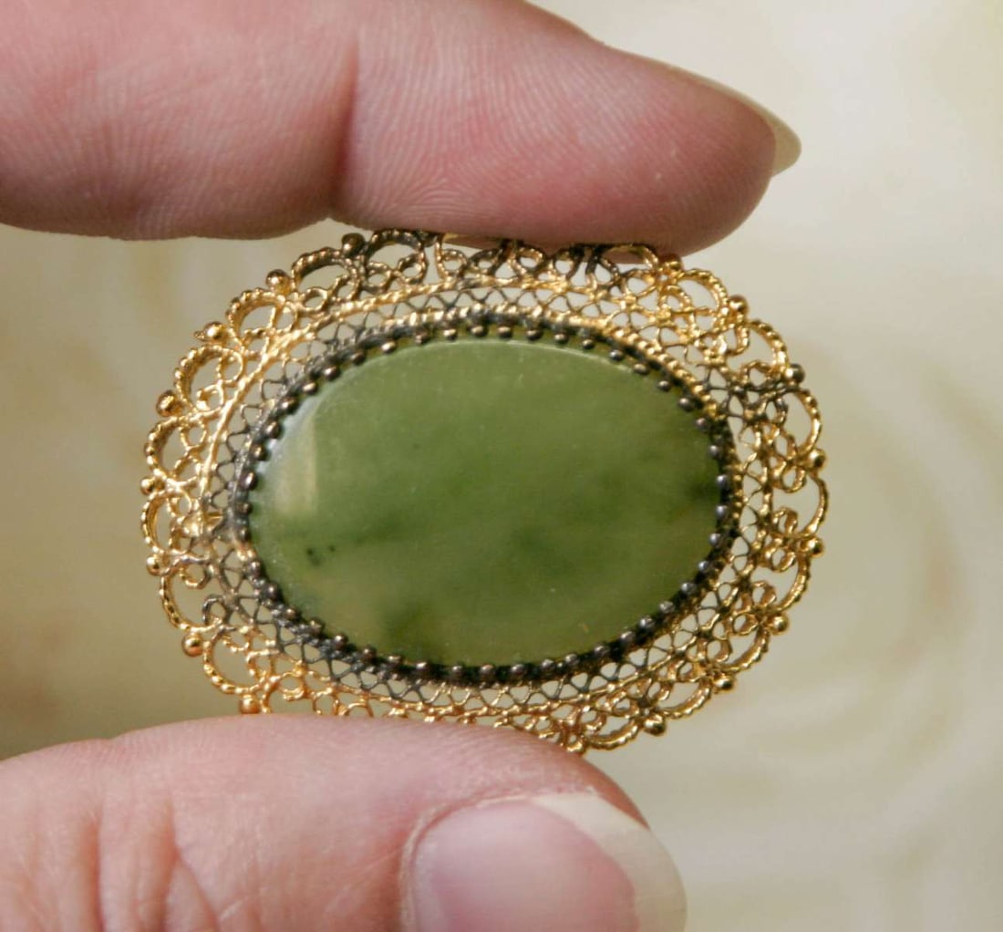 antique estate jewelry: Jade pin brooch: marked Sterling silver and initialed M.L. as shown, gold plated filigree setting with translucent Mutton fat and dark Spinach green marbled oval center stone (Chinese Jade?)about 1 1/2" tal