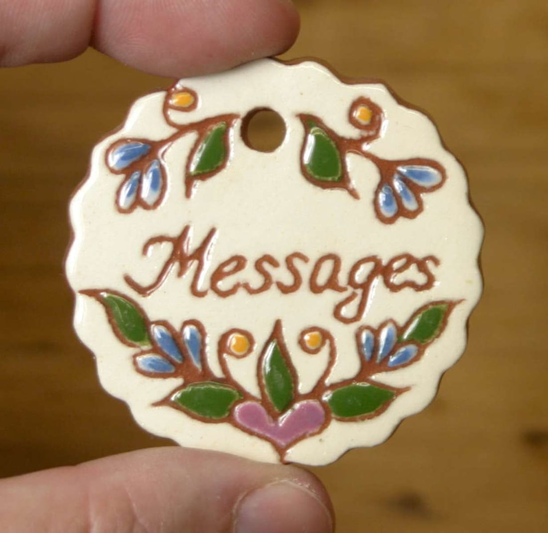 vintage redware Christmas tree ornament: vintage Folk Art polychrome glossy glazed round scalloped redware ornament marked Messages and signed as shown C. Wert