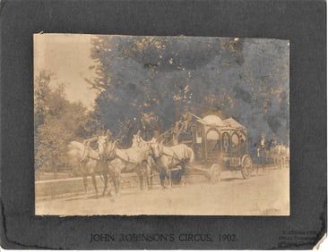 antique mounted photograph of horse drawn circus wagon