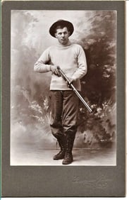 antique mounted photograph of Colorado man with his rifle