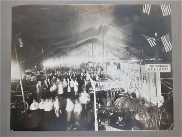 antique cabinet or mounted photo of automobile show under tent