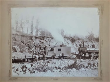 antique cabinet or mounted photograph of train after accident