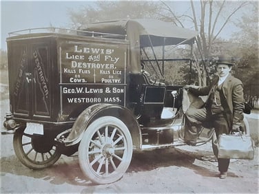 antique cabinet or mounted photograph of exterminator truck