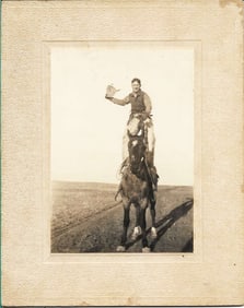 c.1910 cabinet photo of cowboy standing on horse