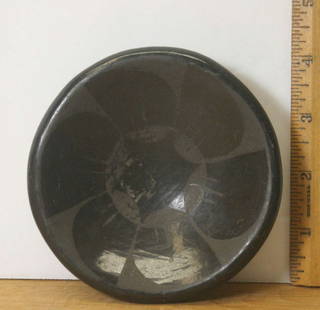 vintage Native American pottery dish: small black on black abstract flower or sun and star design pottery bowl or dish, unsigned Pueblo piece