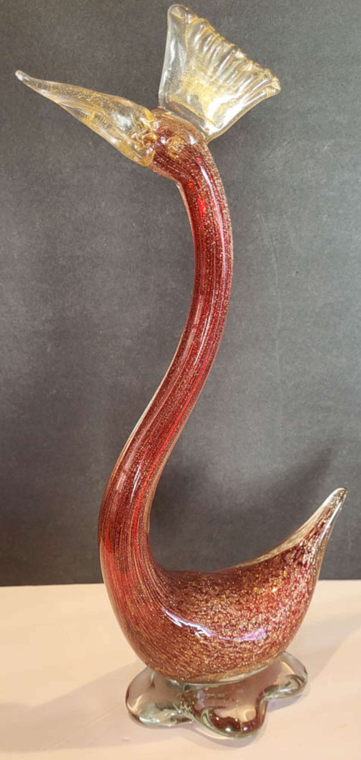 vintage Murano glass bird sculpture: unmarked, but most likely by Murano, this is a tall and beautifully made heavy Art glass statue shaped like a duck or goose with a long neck and reddish/clear tones with gold flecks