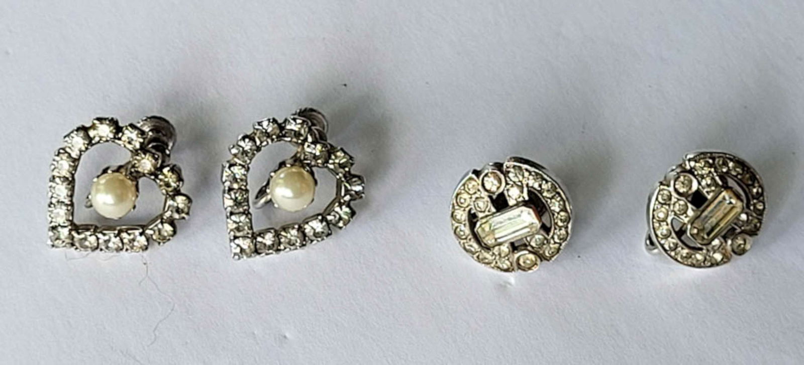 antique estate jewelry: rhinestone earrings: set or lot of two pair of beautiful vintage or antique clear cut rhinestone screwback earrings, one set with faux (or real?) pearl, the other set (with baguette) marked Sterling silver as