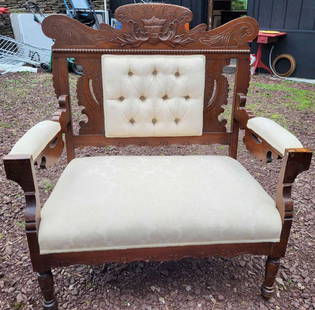 antique Victorian Eastlake settee: antique carved wooden Victorian Eastlake small sofa or loveseat, sturdy and with Damask cream colored upholstery and tufted backwidest dimensions are aprox 34 1/2" wide by 40 1/4" tall