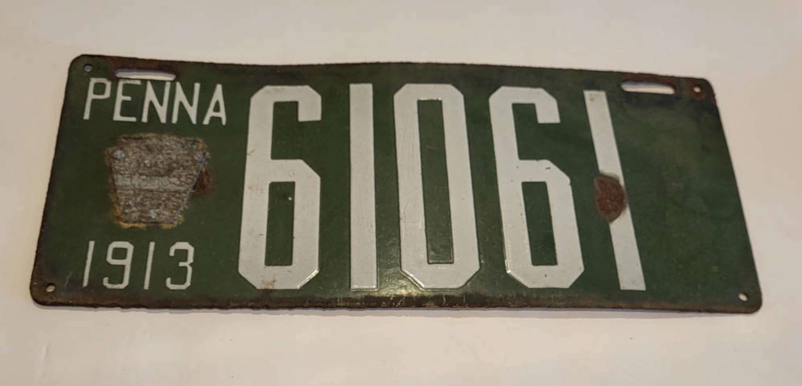 antique Pennsylvania car license plate: antique 1913 automobile license plate, green enamel over steel and with Keystone applied plaque with serial number and reverse with Philadelphia maker's name one just sold on eBay for a who