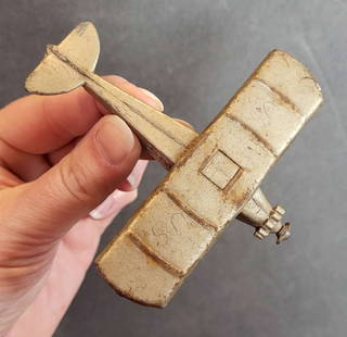 vintage Tootsietoy toy airplane: small marked toy airplane, missing wheels and propeller, original paint