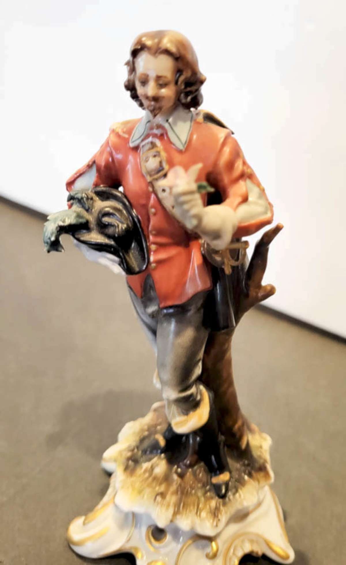 vintage Capodimonte figural statue: vintage A.J. Uffrecht porcelain statue marked Made Italy shaped like a Renaissance gentleman holding his hat under his arm