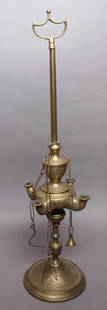 vintage brass table lamp: not sure if this is an incense or an oil lamp&comma; tall model with handle for easy carrying around&comma; possibly Middle Eastern or Indian (?) and with beautiful engraved swirl design