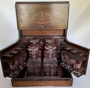 antique Napoleon Era inlaid Tantalus box: beautifully inlaid wooden Tantalus box with pull-up lid (inlays there too) and fold-out hinged shot glass holder (missing several pieces) and central area for cut clear glass (Bohemian?) decanters or