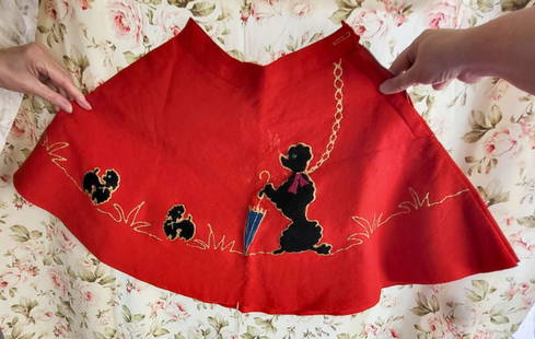 vintage wool felt circle skirt: ca. 1950's wool felt red circle skirt with hand stitched black Poodle or dog on a chain design......holding an umbrella and with a zipper closure