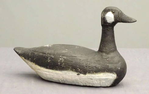large vintage carved wooden bird sculpture: vintage Folk Art carved wooden waterfowl bird (Canadian Goose) decoy in black and white tones&comma; hand painted and plate for the ring (missing) to be used as a working decoyabout 19&quot; long over