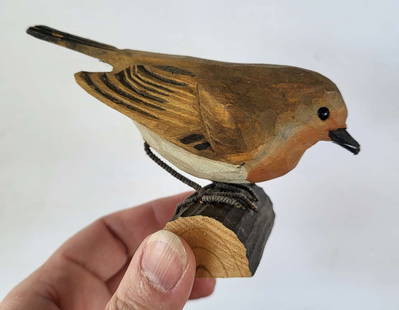 vintage carved Folk Art bird: small vintage carved wooden bird sculpture with wire feet depicting a European Red Robin&comma; with hand painted accents in white and orange&comma; stamped by the reseller
