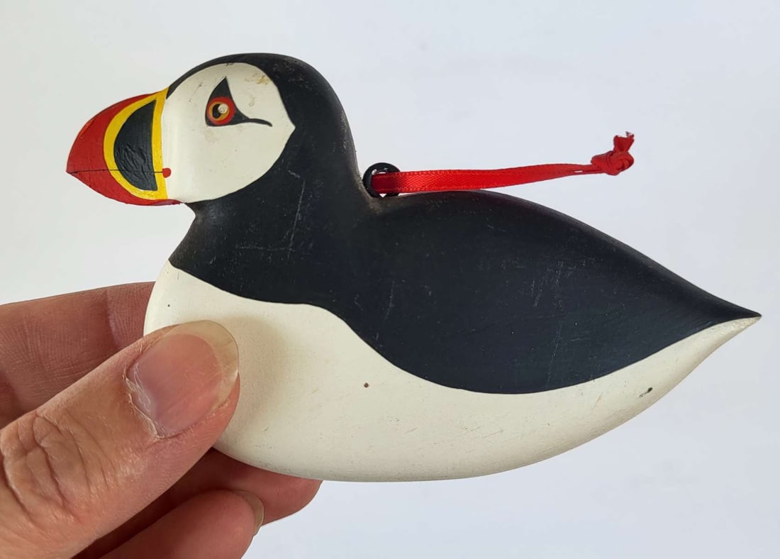 carved signed Folk Art bird: small vintage carved wooden bird (Puffin), signed by the artist Balyeat (likely Steve Balyeat, Maine) and dated 1985 and with a black and white hand painted body with red and yellow accent