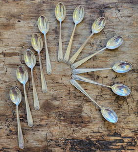 vintage set of 12 Norwegian silver spoons: beautiful vintage or antique set of 12 matching small spoons with an abstract floral woven knot design on the end of the handle and marked as shown 830S, maker's mark and engraved 1937each